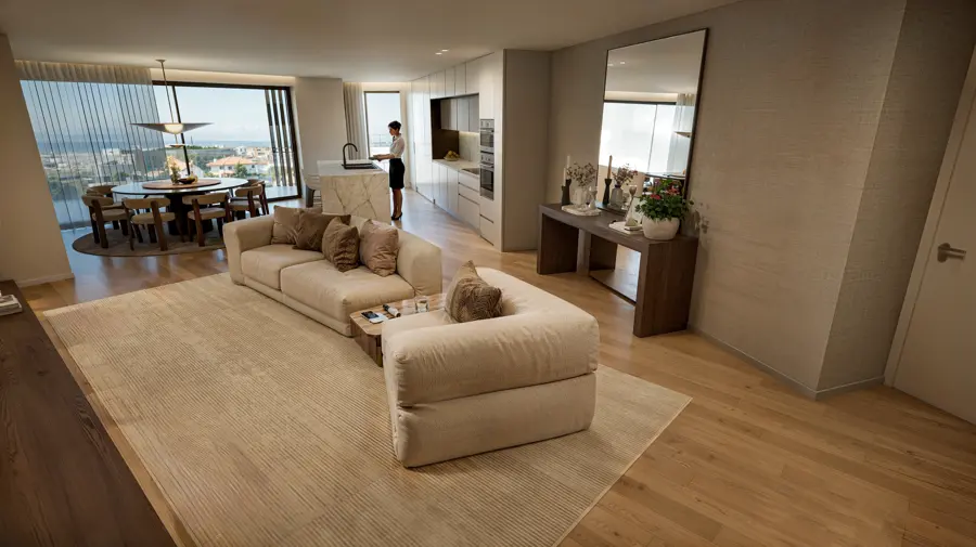 Sala de estar ampla com sofá em tons de areia, pavimento em madeira e cozinha aberta